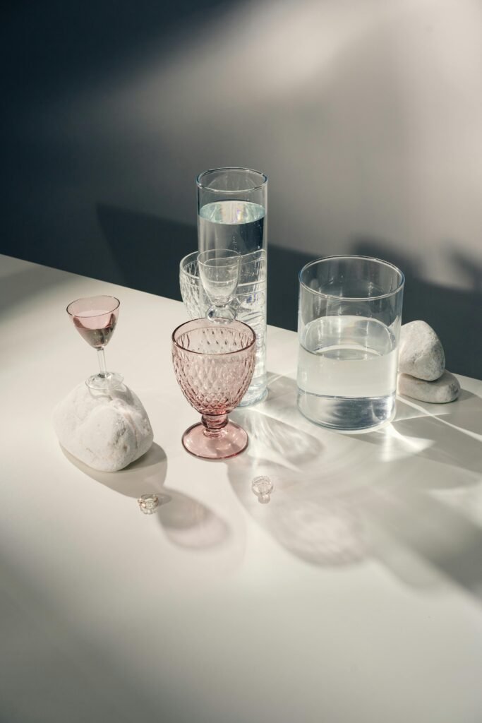 a group of glasses and a rock on a table